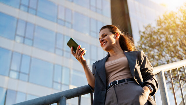 City lifestyle woman browsing smartphone on the street