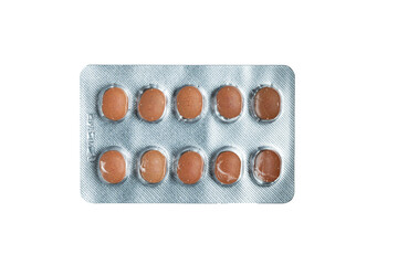 Blister pack with brown oval tablets on transparent background

