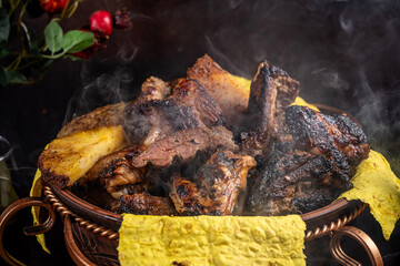 Smoky grilled meat assortment in ornate brazier