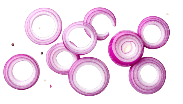 Close-up of sliced red onions rings scattered against a solid black backdrop