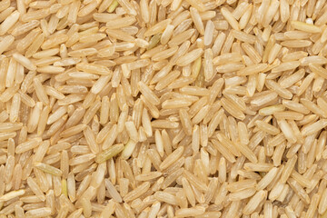 Pile of brown rice grains for background. Top view