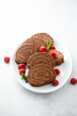 Dark chocolate swiss roll with raspberry