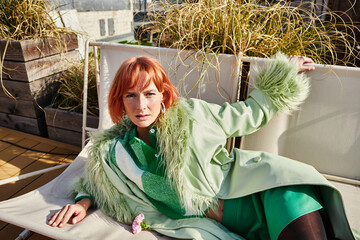 Fashionable young woman enjoys a sunny stroll on a stylish rooftop terrace