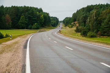 an empty highway in cloudy weather