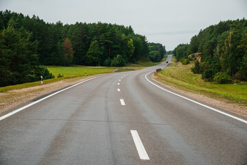 an empty highway in cloudy weather