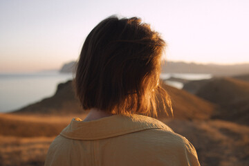 woman looking at sunset