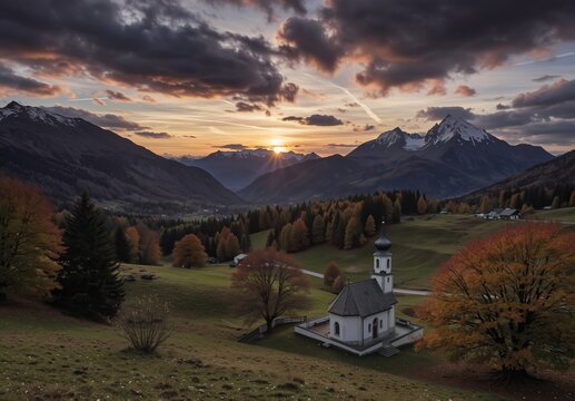 autumnal mountain landscape with quaint chapel at sunset in the european alps