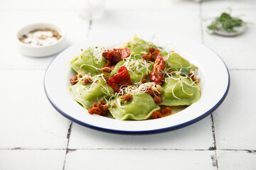 Spinach ravioli with sun dried tomatoes