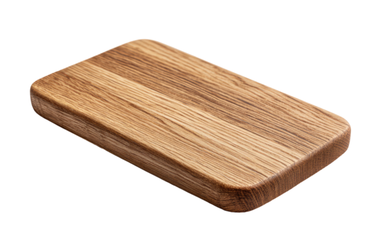 Rectangular oak cutting board with rounded edges on a dark background