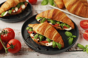 Croissants with mozarella cheese and tomatoes in caprese style	