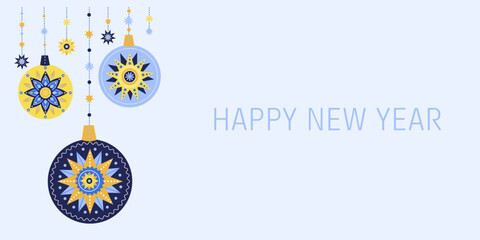 New Year's banner with beautiful Christmas tree balls with yellow and blue ornaments