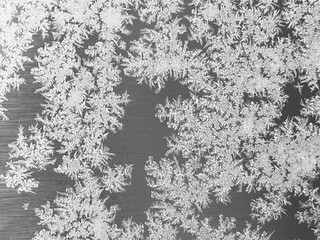 Frost patterns on frozen surface, winter frosty texture