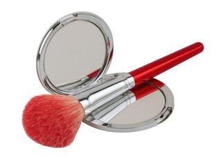 Makeup brush resting on compact mirror, red handle, light bristles