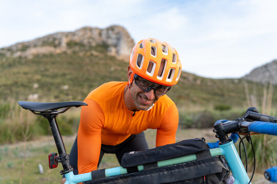 Gravel cyclist smiling enjoying outdoor biking adventure