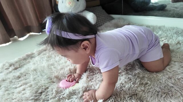 A baby lifting their body in a crawling position showing early physical movement development