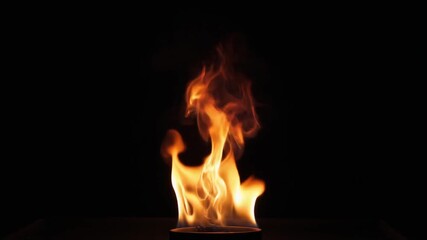 Dynamic orange fire flame burning brightly against black background hot slow motion clip footage element - Powered by Adobe
