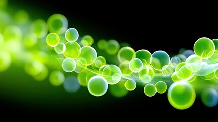 A dynamic abstract composition featuring numerous translucent green spheres and glowing light streaks against a dark, blurred background.
