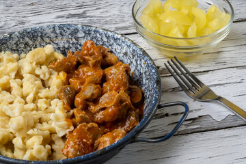 Hungarian chicken gizzard stew with dumplings