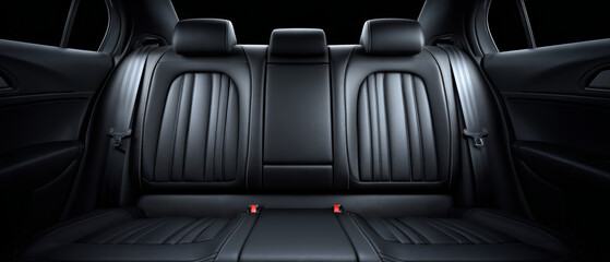 Close-up view of a luxurious black leather car rear seat showcasing safety shoulder belts, designed for comfort and style with a polished finish