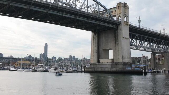 Gimbal panning shot of the Burrard Bridge over False Creek in Vancouver, British Columbia, Canada. 4K
