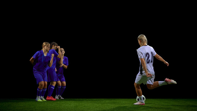 Teenage soccer player performing free kick against defensive wall. Concept of youth tactical lessons, set-piece education, coaching materials, match analysis tools.