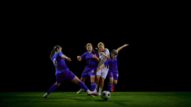 Teenage soccer players battling for ball in multi-player challenge. Concept of youth competitive drills, pressure situations teaching, match-strategy content, team training. - Powered by Adobe