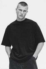 Studio portrait of man in black t-shirt