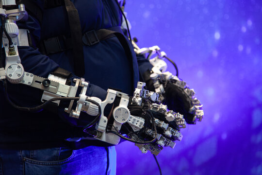 limb exoskeleton worn by man in blue jeans