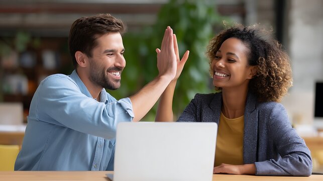 Multicultural business group working together in a modern office environment - Powered by Adobe