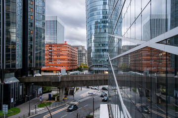 Architecture and skyscraper lines rising in Paris with reflection elements enhancing finance and business themes across the urban landscape that defines the corporate district of La Defense.