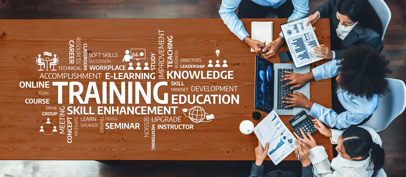 Aerial view of a collaborative training session focused on skill enhancement and knowledge development in an e-learning environment with professionals engaged in work. Amity - Powered by Adobe