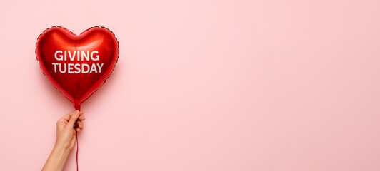 Giving Tuesday heart balloon on pink background