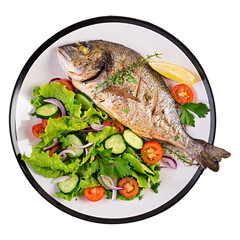Whole roasted fish served with fresh green salad and cherry tomatoes. 