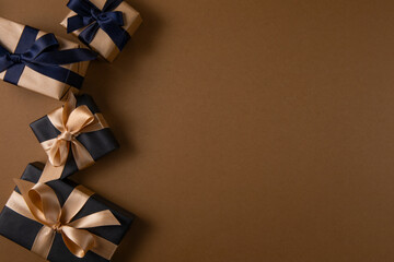 gift boxes with ribbon on brown background