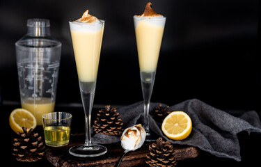 Lemon meringue cocktail with toasted topping in tall flute glasses