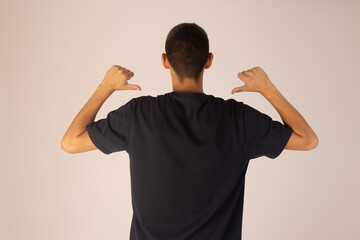 Man is pointing to themself with both hands