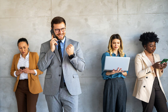 Portrait of successful multicultural business team working in corporate business office