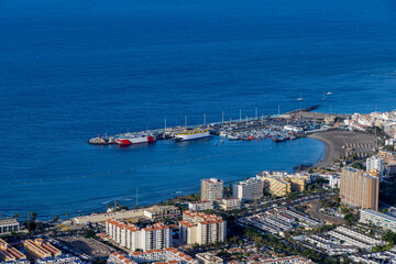 Panorama of the town of Los Cristianos with a volcano in the background. Tenerife, Canary Islands