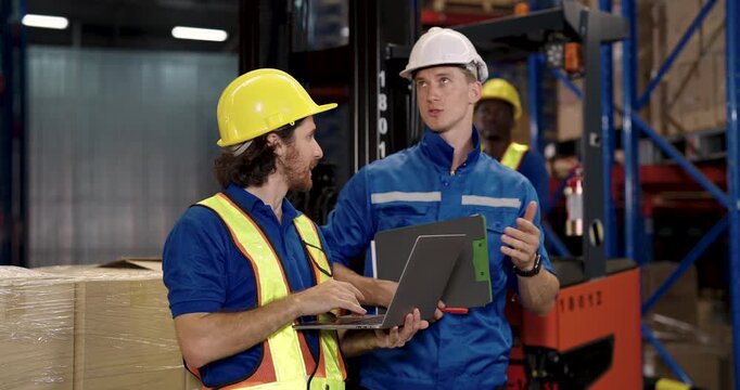 caucasian male warehouse worker looking up and smiling while relaxing near cargo pallet showing moment of relief and human emotion during logistic operation in distribution stock facility - Powered by Adobe