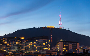 Evening View of Television Tower and Cityscape Lights
