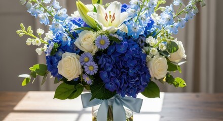 Elegant floral arrangement showcasing white roses, blue hydrangeas and delphiniums centerpiece