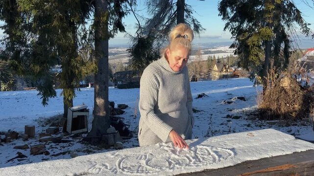 Woman hawing fun with the first snow