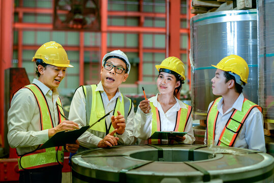 Factory apprenticeship. Header mentor teaching group of young employees trainee operating machine looking monitor and check Production process machinery. foreman explaining team engineer factory