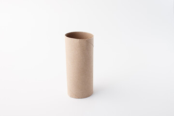 Used toilet paper core isolated on white surface, ideal for advertising, retail packaging, environmental awareness, cleaning industry, product design, household supply branding.
