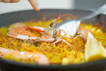 Shrimp on Spanish seafood paella with noodles, giant shrimp on noodles