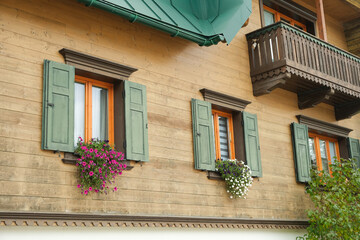 Traditional European Wooden House Windows with Shutters