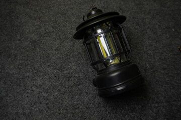 Modern LED Camping Lantern on Dark Textured Background