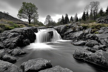 Serene long exposure waterfall with a touch of green amidst a rocky landscape