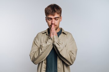 Young man practicing mindfulness and meditation in a calm environment to find inner peace and focus