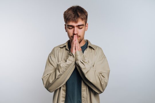 Young man practicing mindfulness and meditation in a calm environment to find inner peace and focus